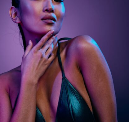 Woman asian trendy model pink disco multicolor blue attractive purple lady fashion hair glamour beauty art red neon colorful face vivid light